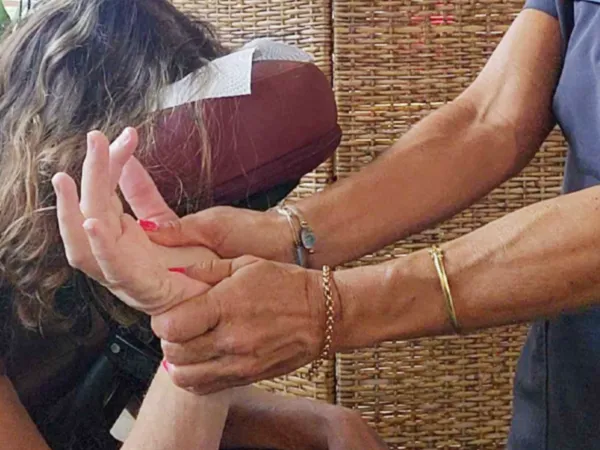 Close view of focused professional massage care